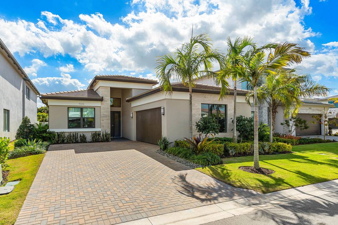 Seize this rare opportunity to purchase an expanded, move in ready, one story home in Lotus Edge, one of Boca Raton's most desirable new luxury communities.