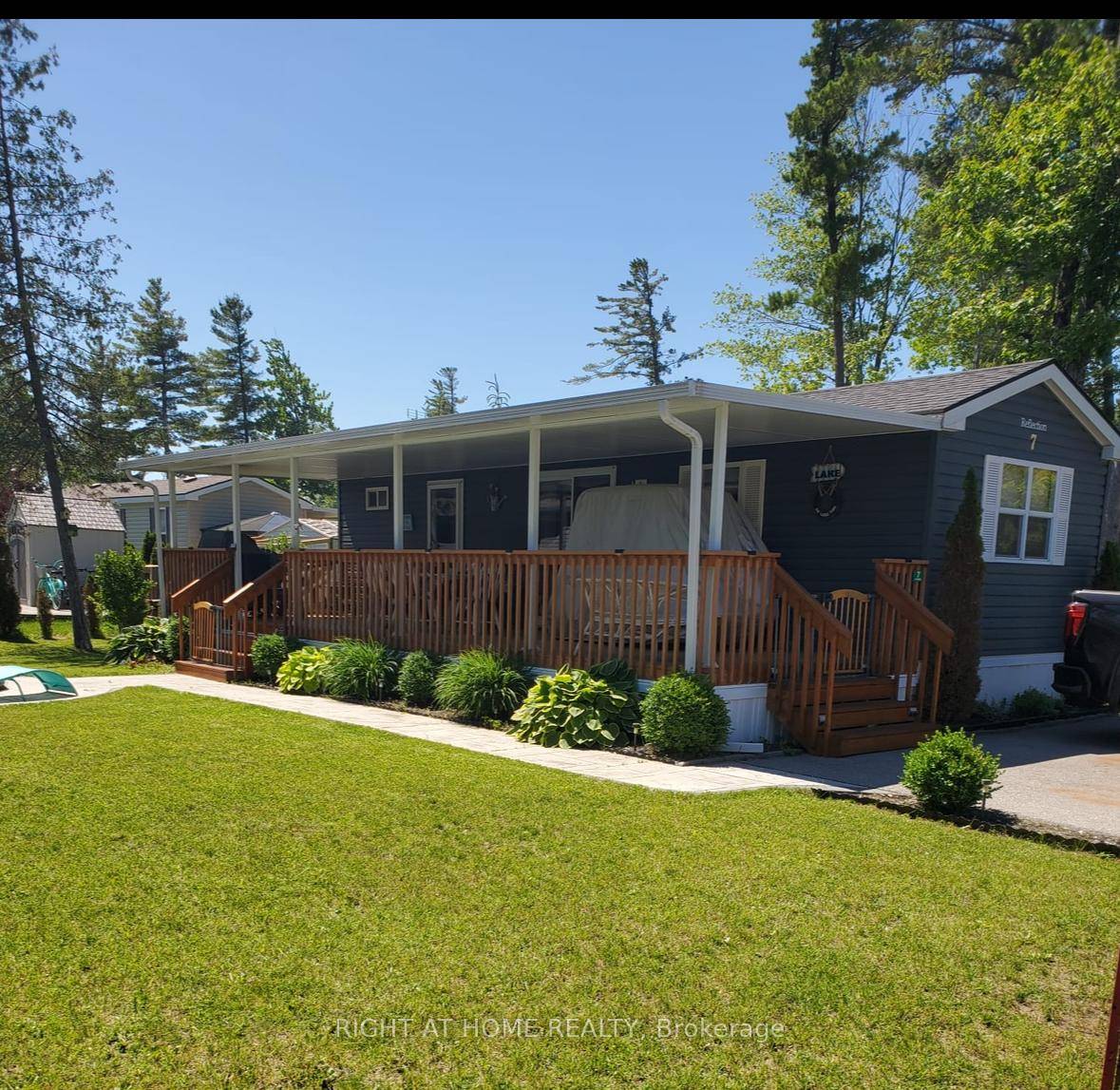Welcome to 7 Nipagon Cir, a remarkable 2015 Northlander cottage in the desirable Parkbridge's Country Life Gated Resort.