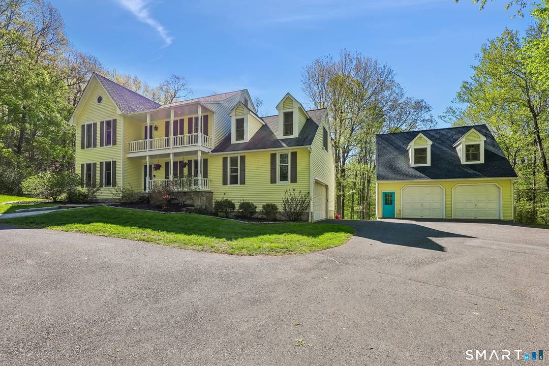 Discover the perfect blend of privacy, charm and timeless appeal nestled on two serene acres in the desirable western section of Bethel.