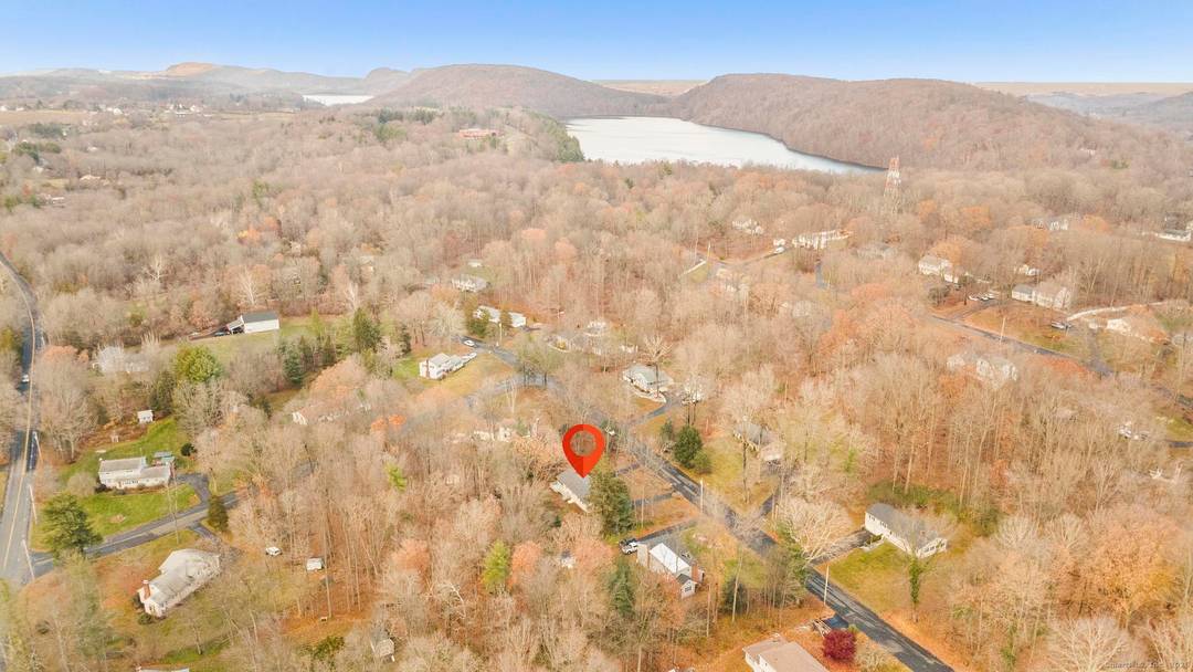 24 Evergreen Road in North Branford offers a peaceful residential setting with convenient access to local shops, parks, and commuter routes.