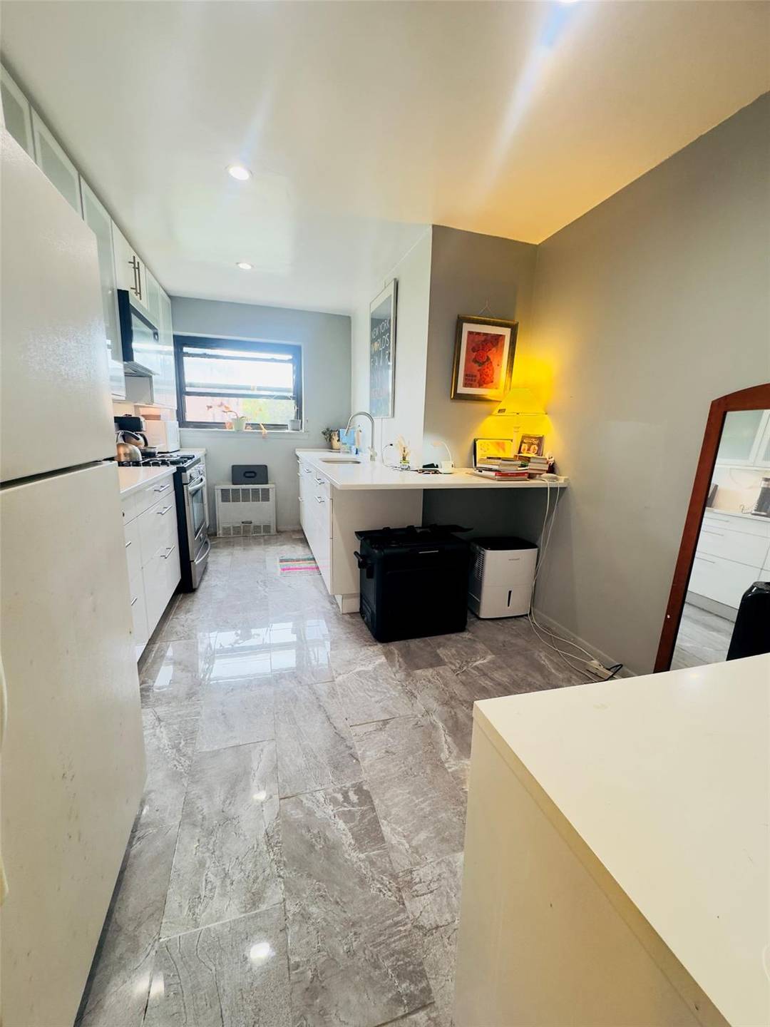 Located in a beautiful and well maintained co op building in the heart of North Flushing, this oversized corner unit 2 bedroom, 1.