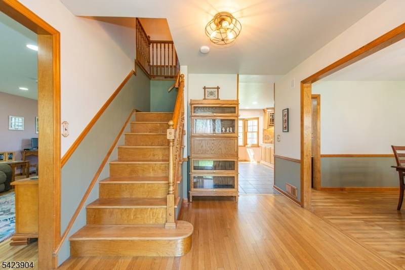 Updated Colonial nestled in the heart of sought after Shongum Lake community.