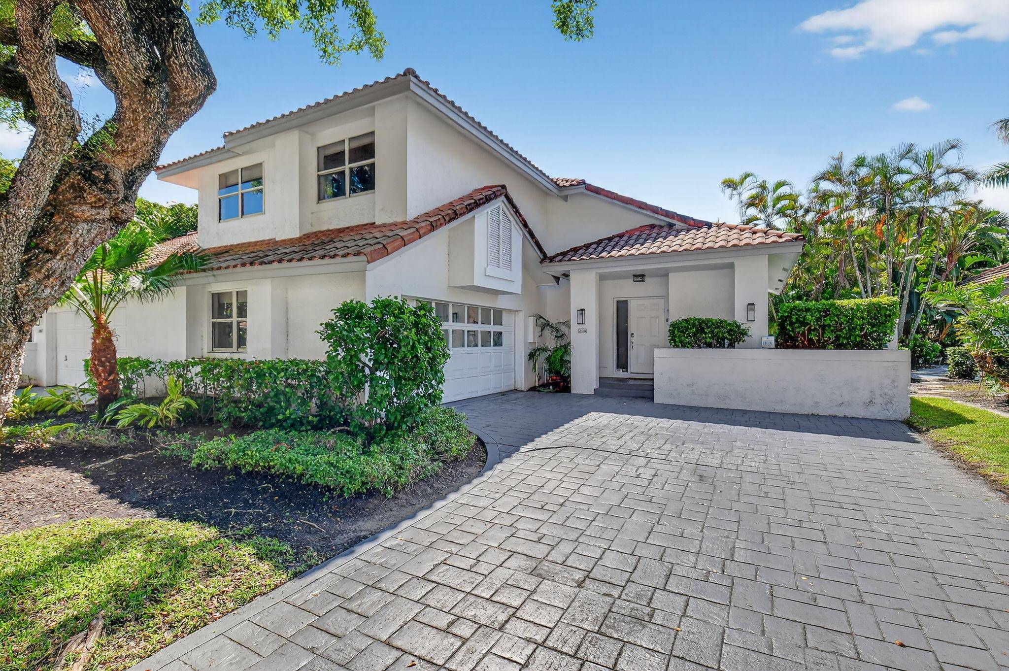 Discover this beautifully updated 2 story townhouse located in the sought after village of Cedar Cay in the prestigious Broken Sound Country Club.