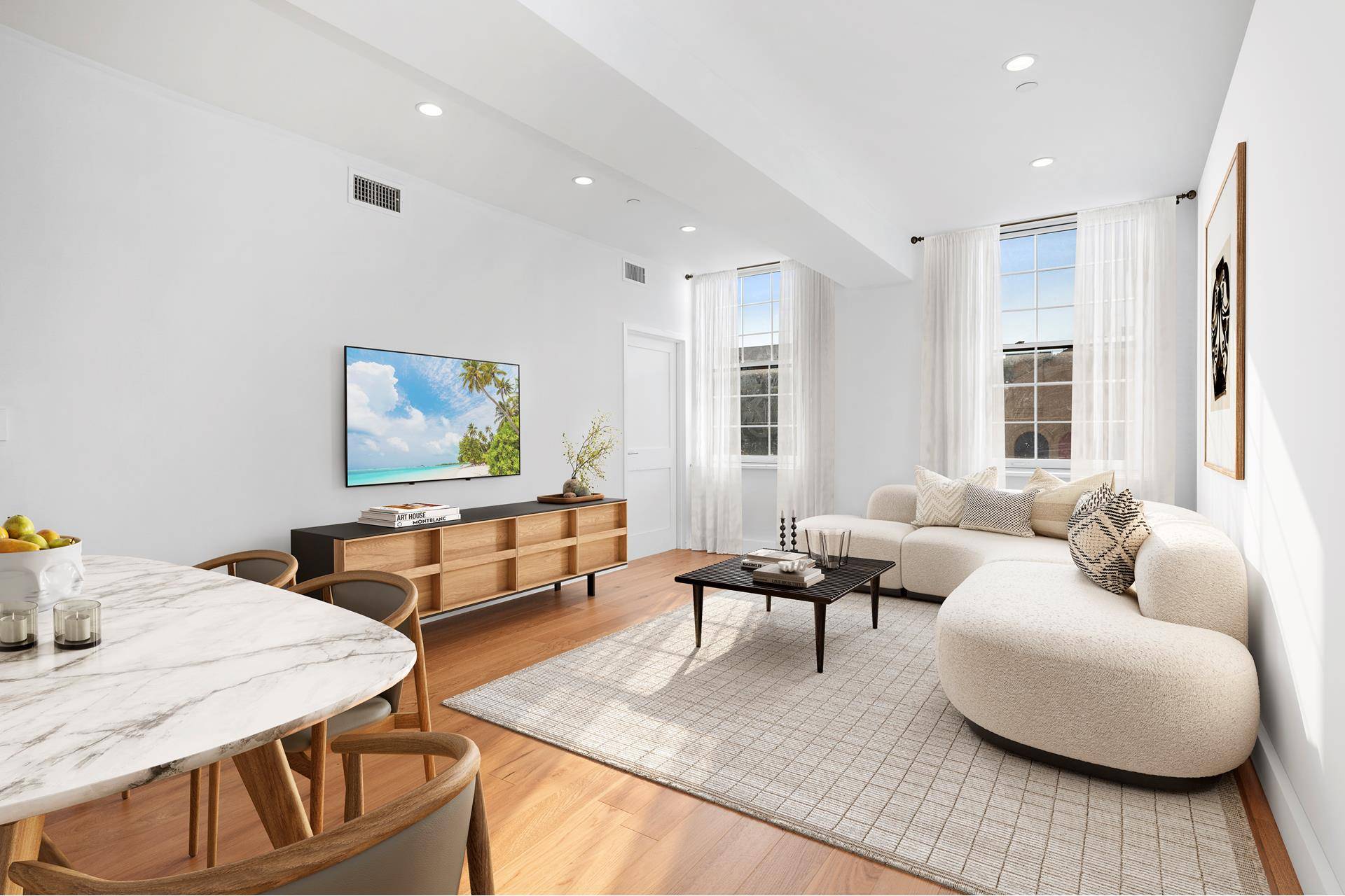 Residence 302 is a spacious two bedroom home with oversized windows and wide plank wood flooring throughout.