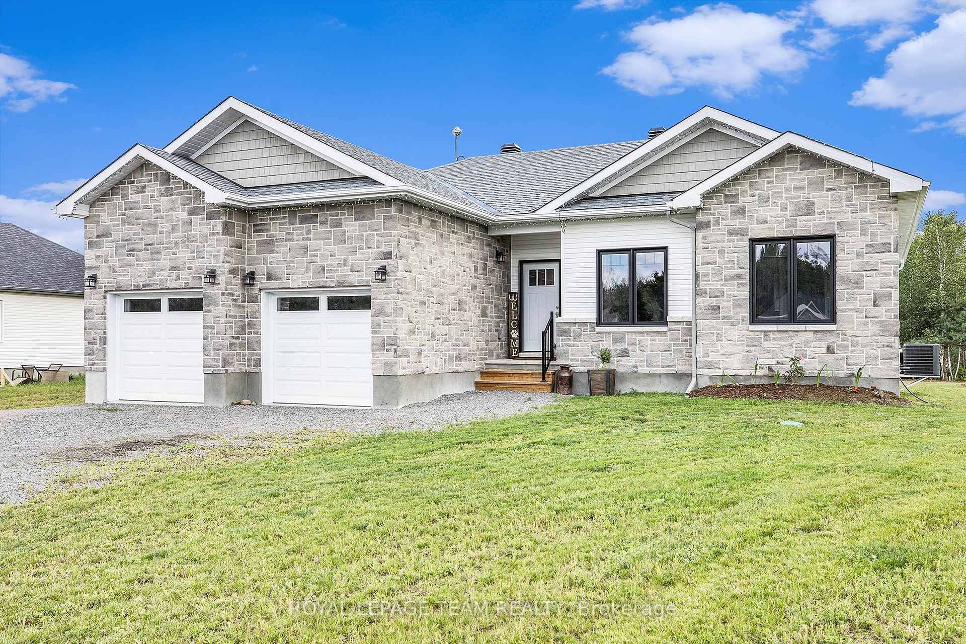Ready to call home ! Turnkey bungalow with gorgeous stone facade is situated on a little over an acre.