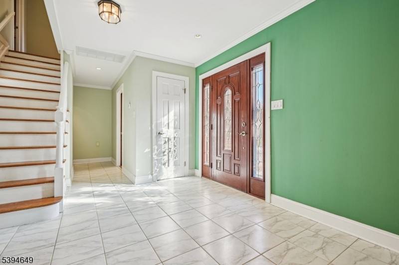 Welcome to 4 Punch Bowl Road, a beautifully designed custom home set on 1.