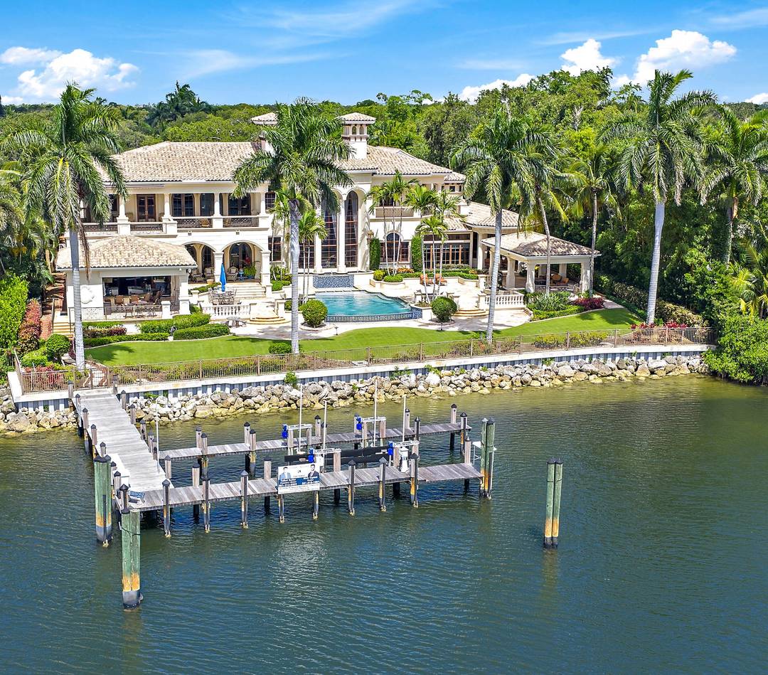 Experience the ultimate in luxury living at this exceptional Palm Beach Gardens waterfront estate.