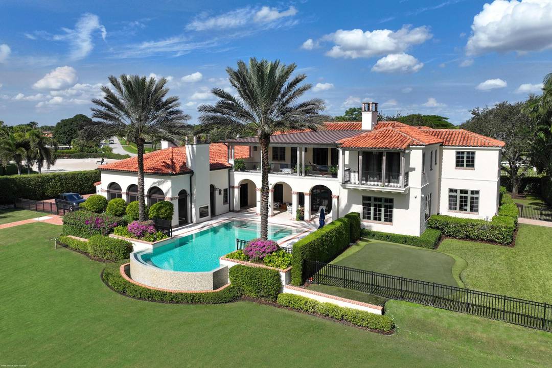 A true masterpiece ! Unmatched equestrian estate positioned next to Wellington International horse show grounds.
