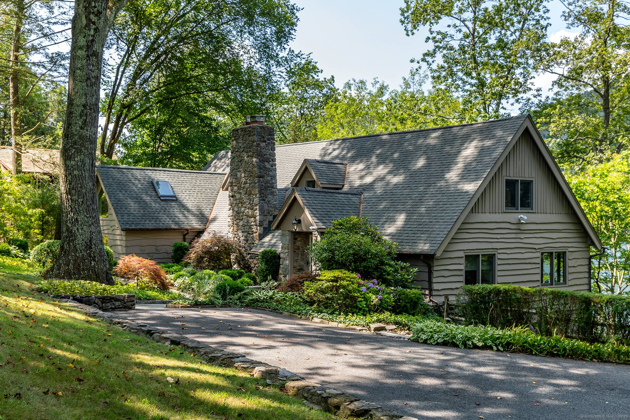 Quintessential Candlewood Lake Stone Cedar expanded cottage exudes authenticity with modern day amenities and a plethora of quality updates !