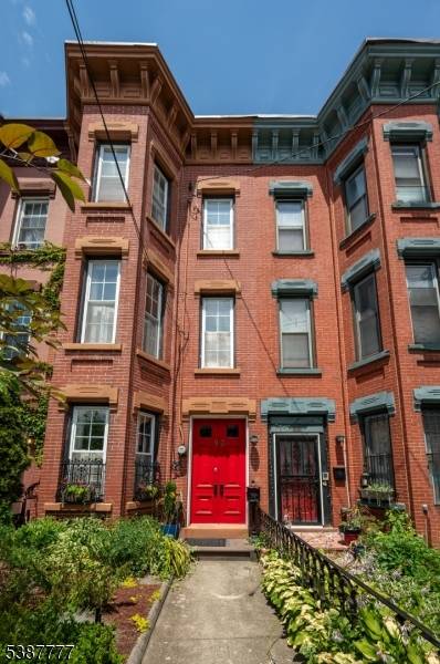 The opportunity to own a rare 1875 brick historic townhome awaits at 97 Palisade.