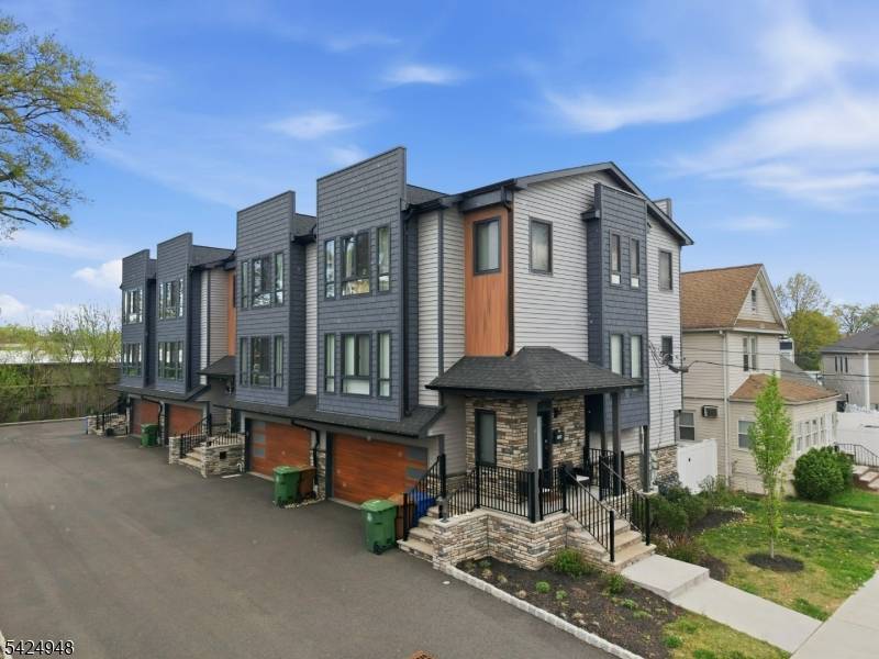 Experience modern living in this beautifully designed 3 level end unit townhouse, built in 2023.
