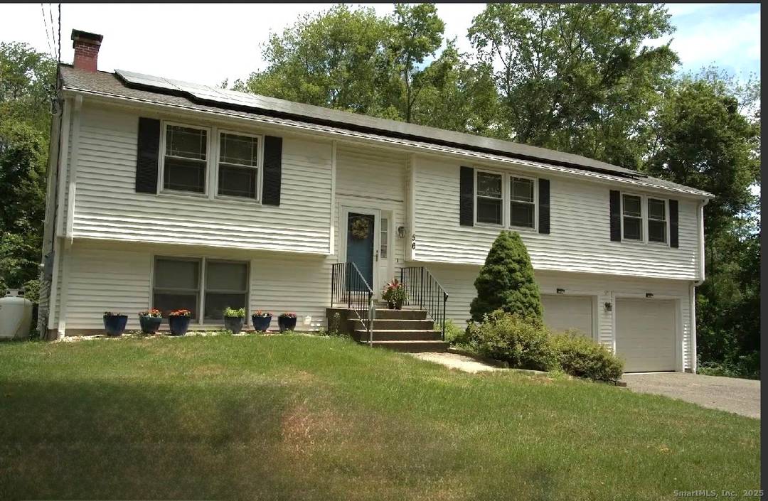 In a very private setting tucked off the main road and hidden by mature trees, this beautifully maintained raised ranch sits on over 1.