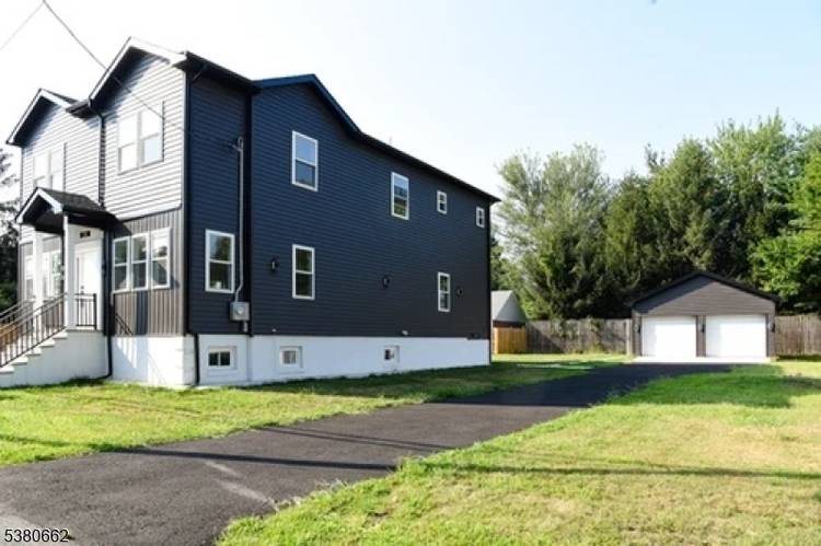 This stunning custom home, completed in 2025, seamlessly blends luxury and modern design, featuring an open concept layout that invites natural light into every corner.