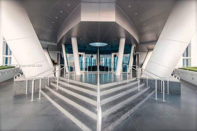 This direct oceanfront residence offers a one bedroom layout den, ideal for sleeping or working space.