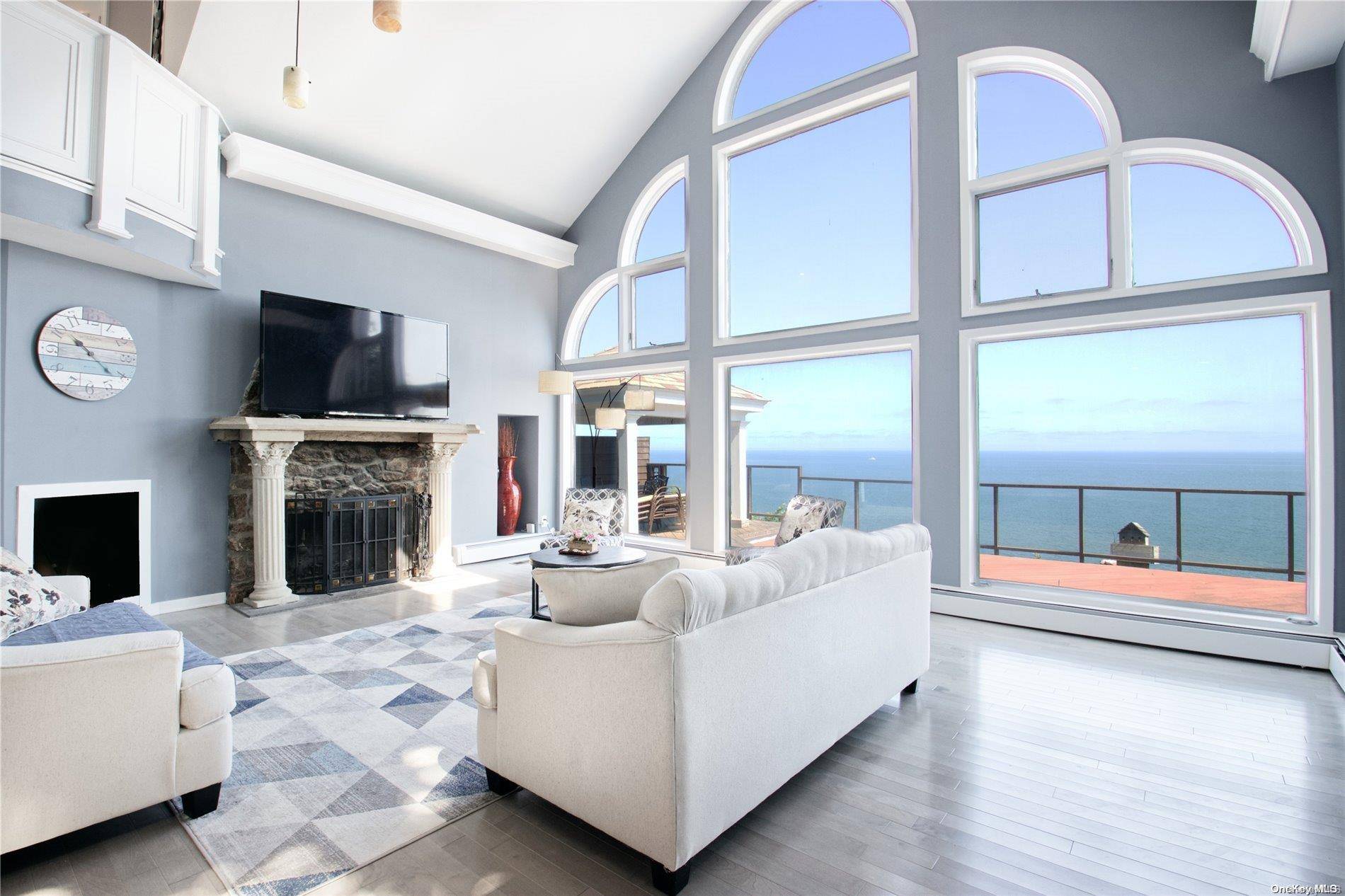 Welcome to this Stunning Waterfront Haven in Rocky Point, where every step inside reveals breathtaking views of the Long Island Sound.