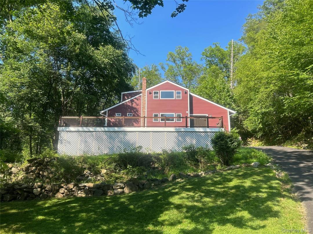 Discover this beautifully renovated home nestled on over 2 acres of lush greenery in the heart of Northern Westchester County.