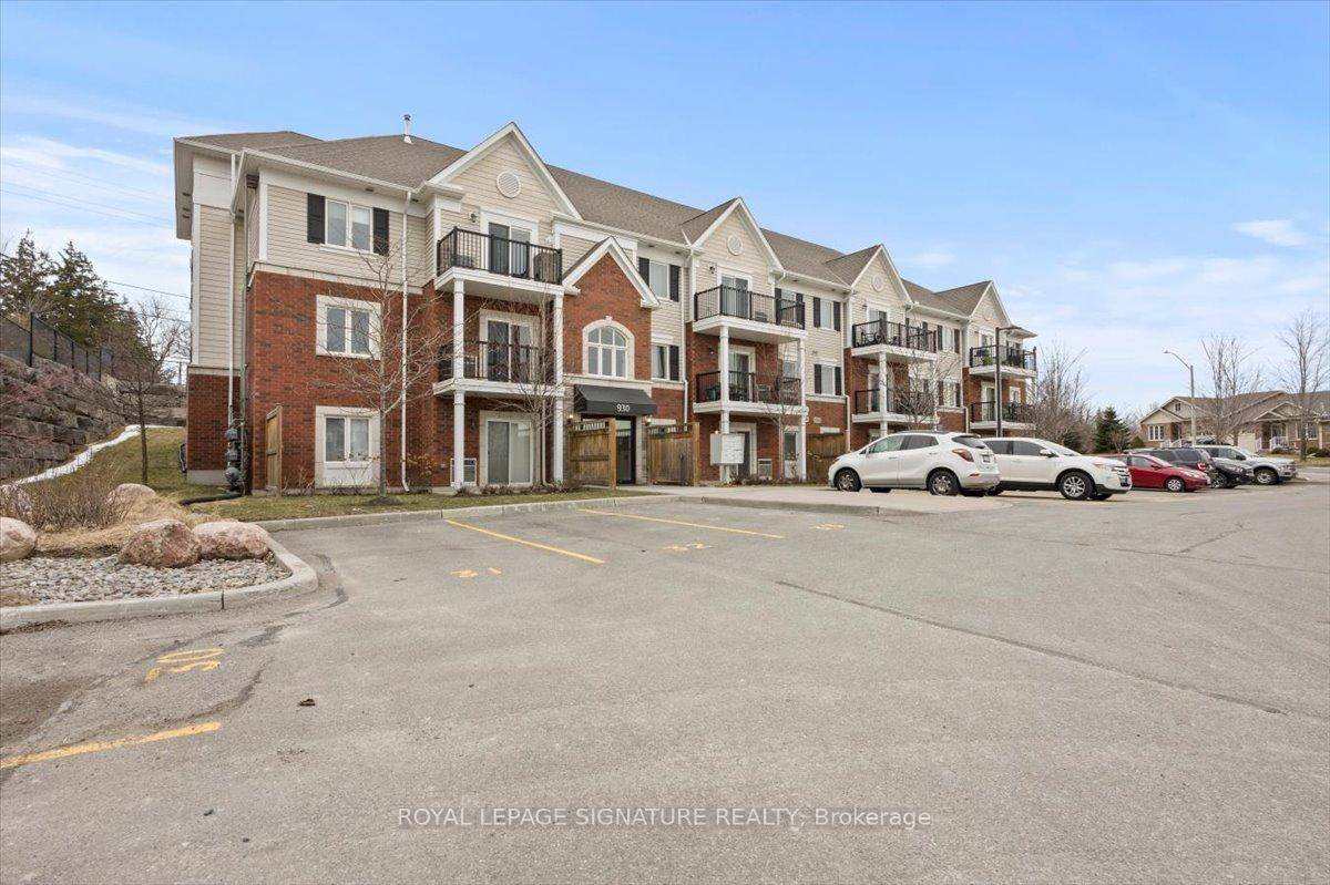 This charming 2 bedr, 2Bath unit features a walkout to a cozy balcony and green space at the back of the building.