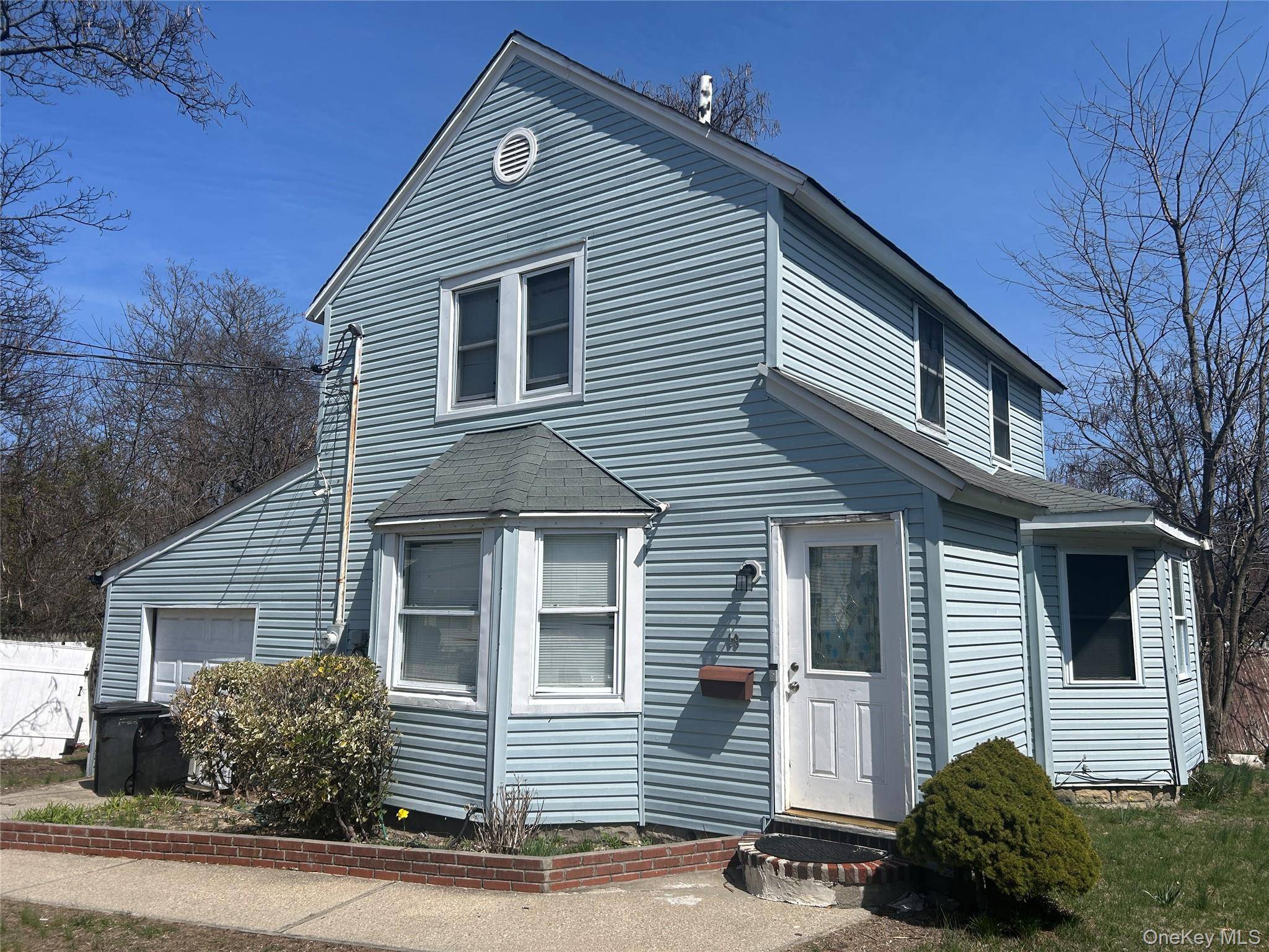 4 bedroom 2 bath with 2 car garage home in Bayshore with HALF basement in quiet dead end street.