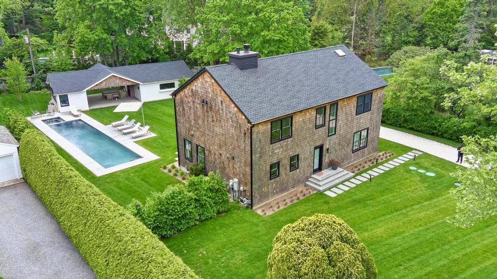 Discover luxury living in this new construction on one of Bellport's prettiest streets located in the heart of the Village.