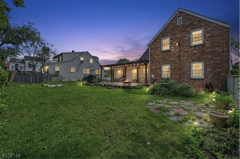 This timeless brick Colonial sits on a spacious corner lot along a picturesque, tree lined street.