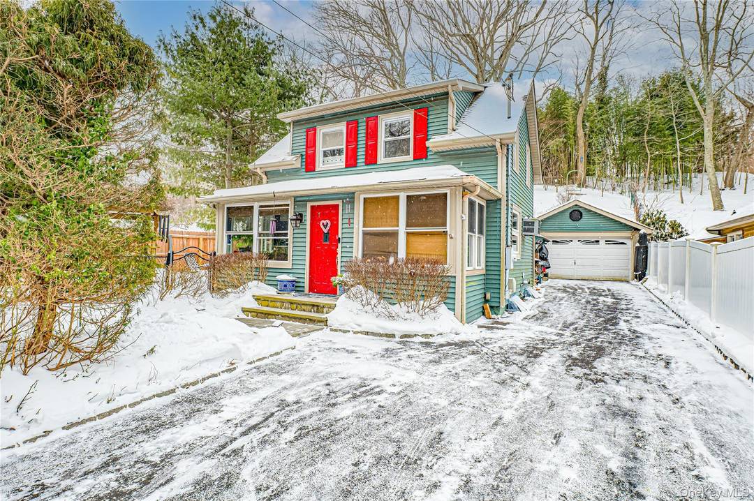 Charming 1928 Colonial, lovingly maintained, featuring a detached 2 car garage, updated spacious EIK, new bathroom offering radiant heated floors, natural gas heat, sewers !