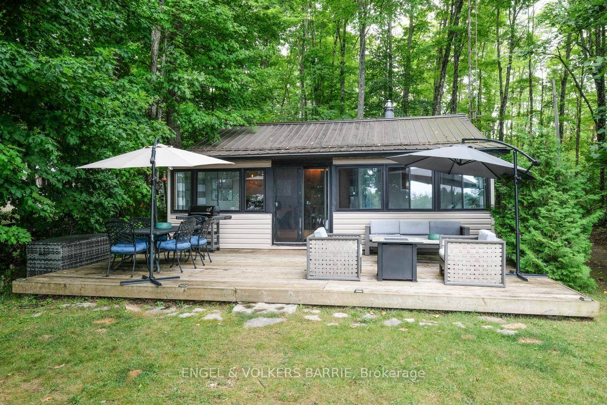 This two bedroom Talbot Lake cottage features sunny open concept and cozy charm.