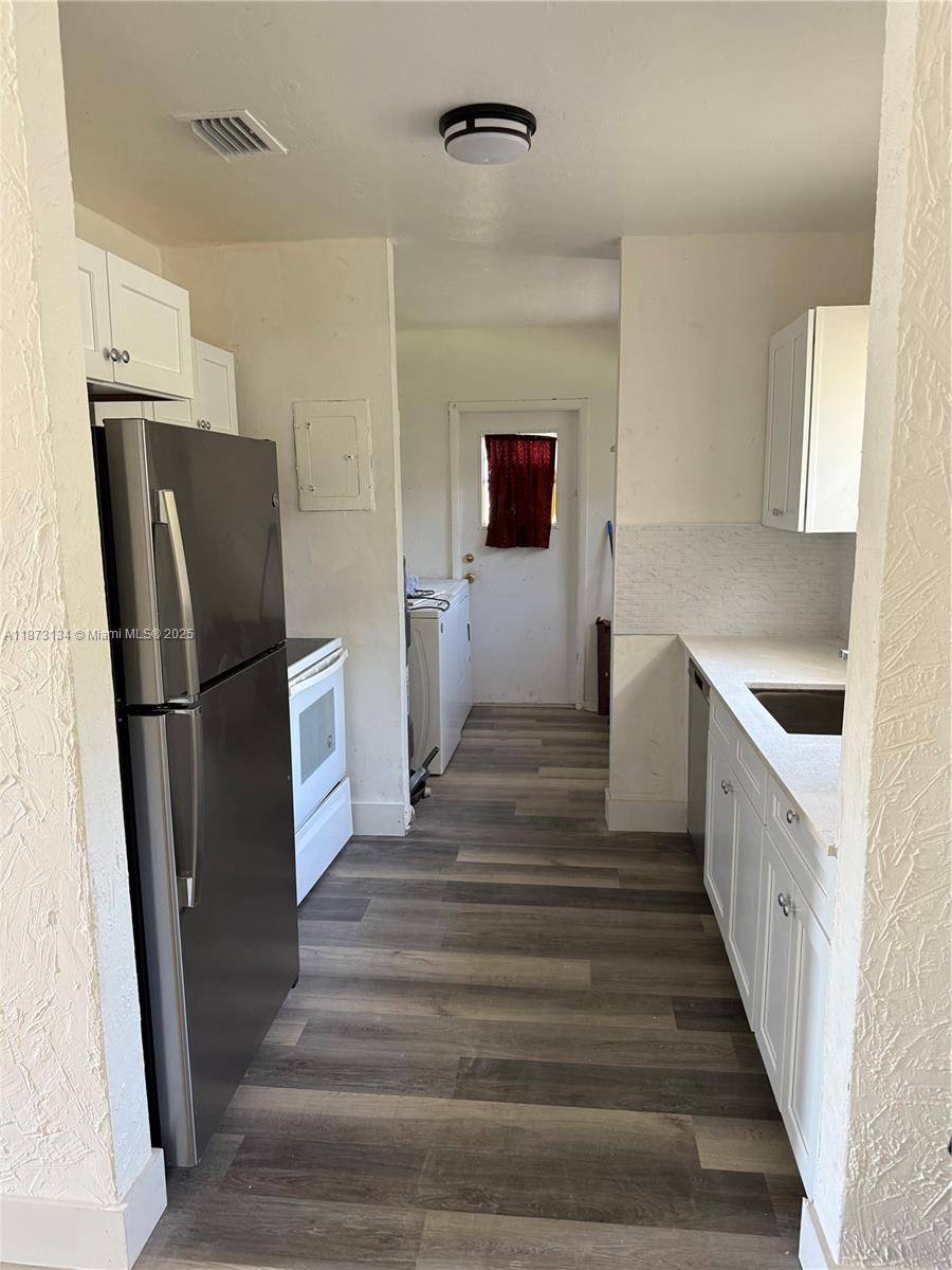 Nestled in a quiet Lauderhill neighborhood, this stunning three bedroom single family home is abundant in natural light and modern finishes.