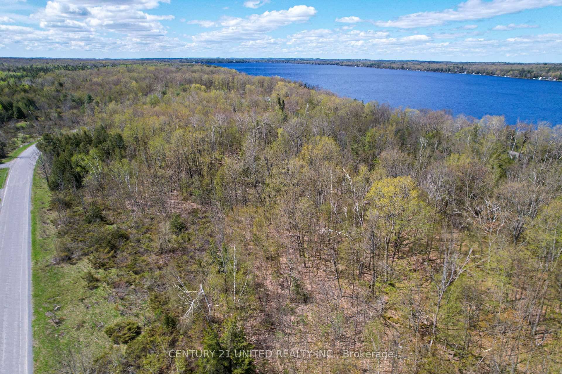 Surrounded by the tranquility of nature, this serene 7 acre lot offers year round access on a quiet municipal road with frontage on both Birchview Rd and Tedford Ln.