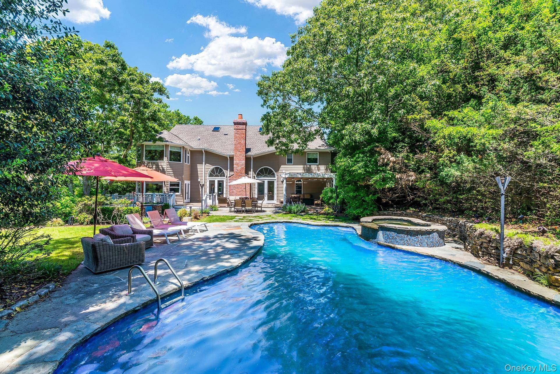 Welcome to 98 Spring Pond Lane, a stunning year round retreat or primary residence in Southampton.