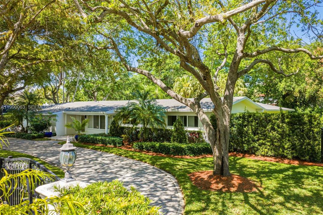 Welcome to this exceptional 4 bedrooms 3 baths Pinecrest residence, offering timeless appeal and impeccable maintenance behind private gates on an expansive 37, 461 SF lot.