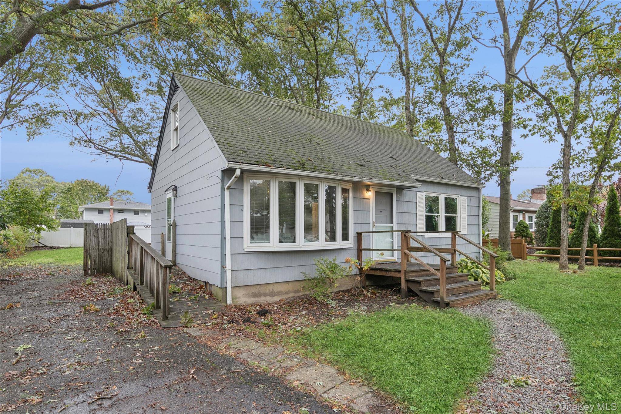 Welcome to this charming Cape Cod nestled on a quarter acre lot in the heart of Eastport Manor Schools !