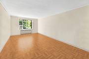 Unit 1CW at Chelsea Gardens is a pre war one bedroom apartment elevated above the garden that feels like it's on the second floor.