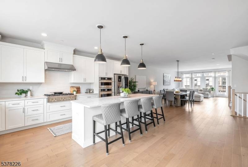Experience luxury and convenience in this better than new Carlough townhome at Village Springs.