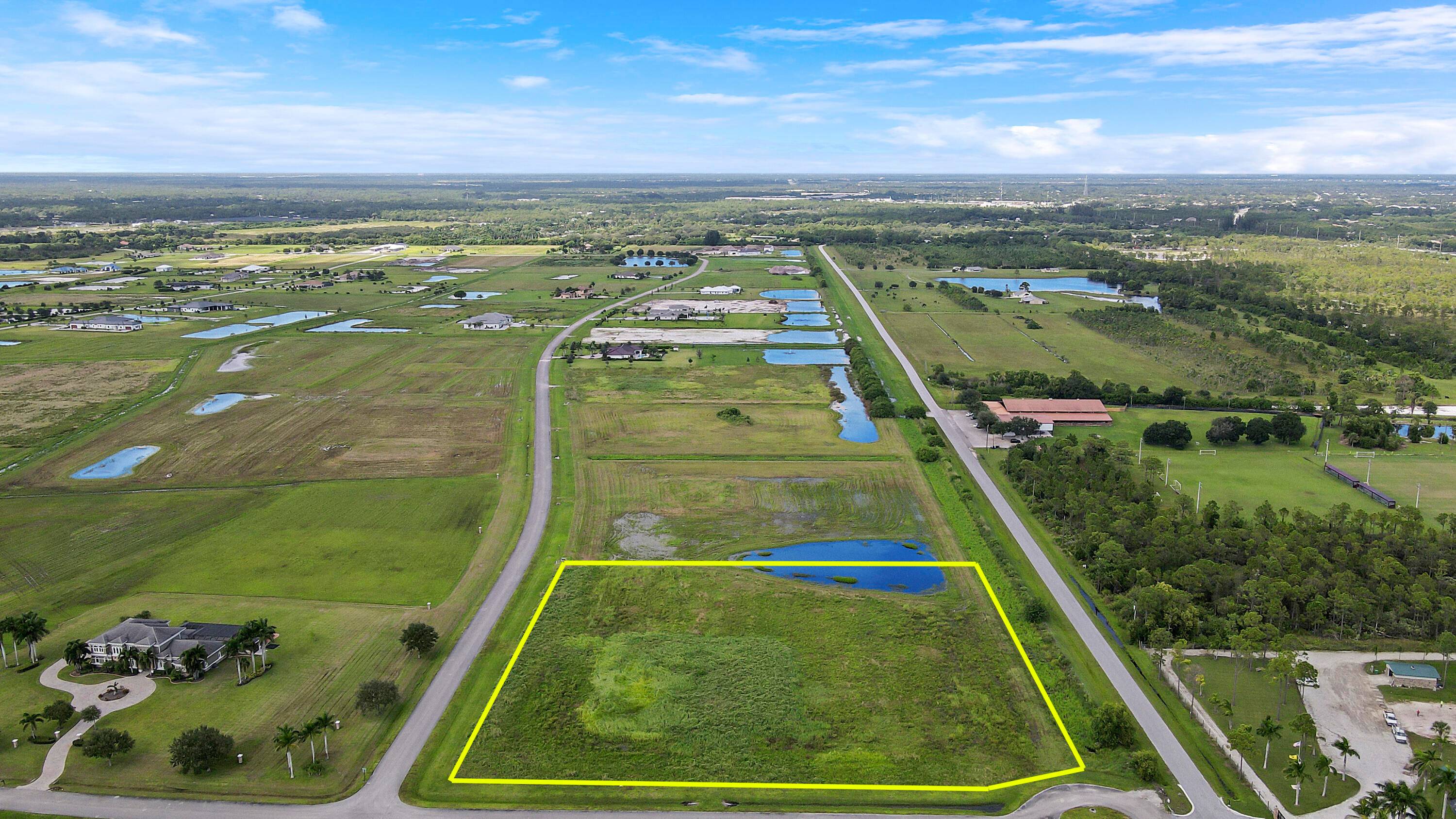 Located in a secure Equestrian Community with 5.