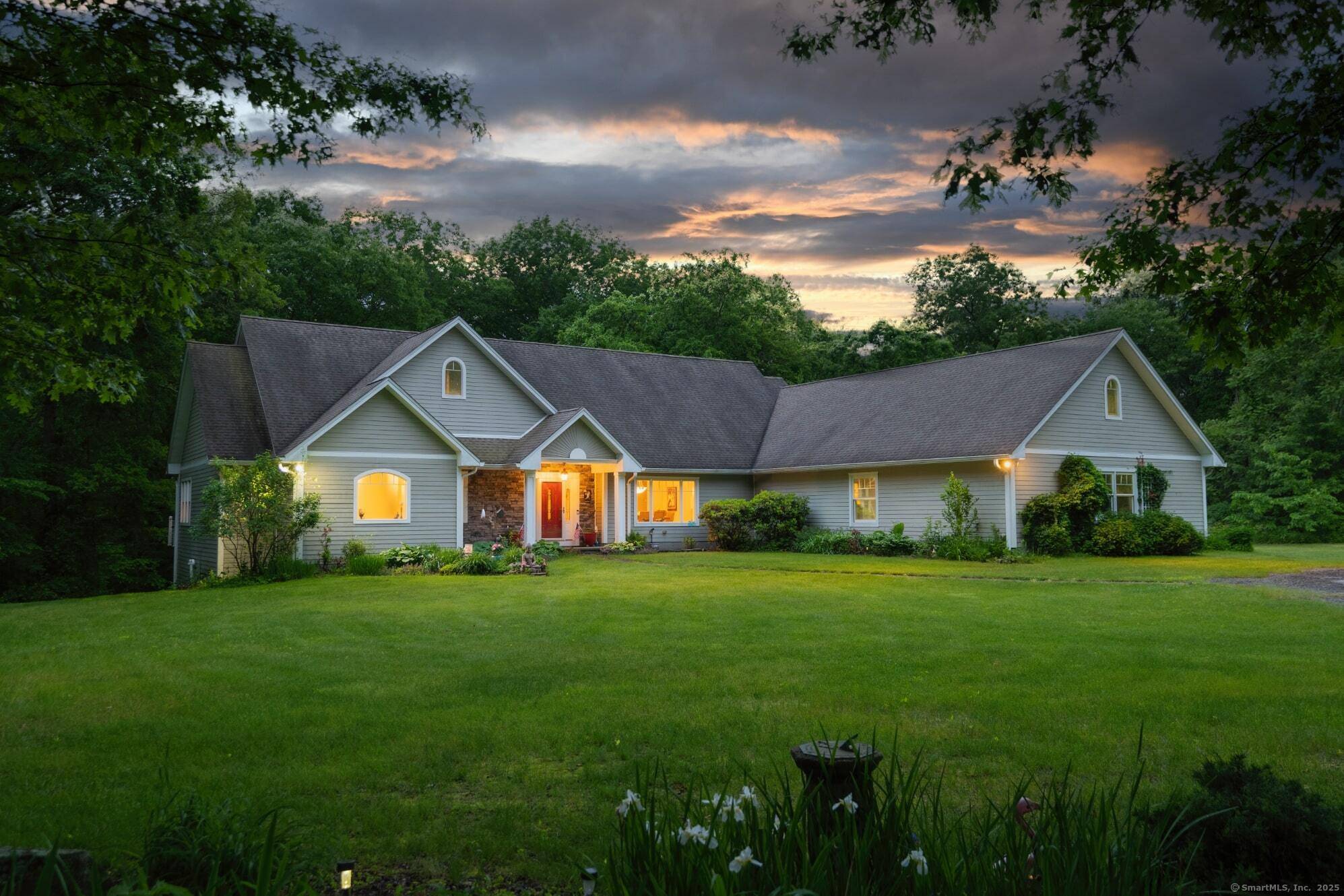 This completely private, one level Ranch in Cranston, RI offers a spacious and thoughtfully designed layout, beginning with a large foyer that opens into an expansive living room featuring a ...