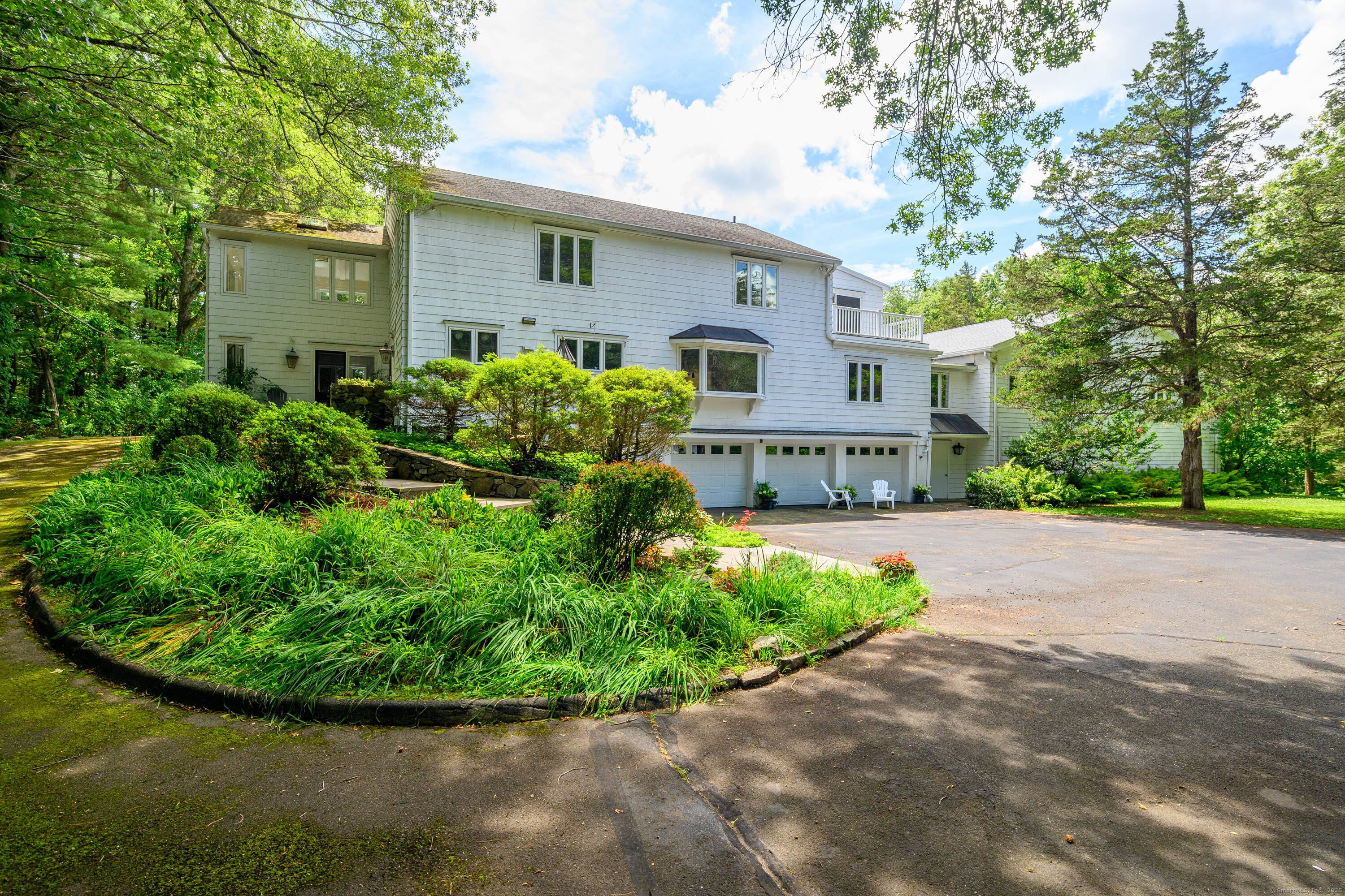 Welcome to 116 Brushy Hill Road and 2 Beaver Dam, where mid century charm meets modern living.
