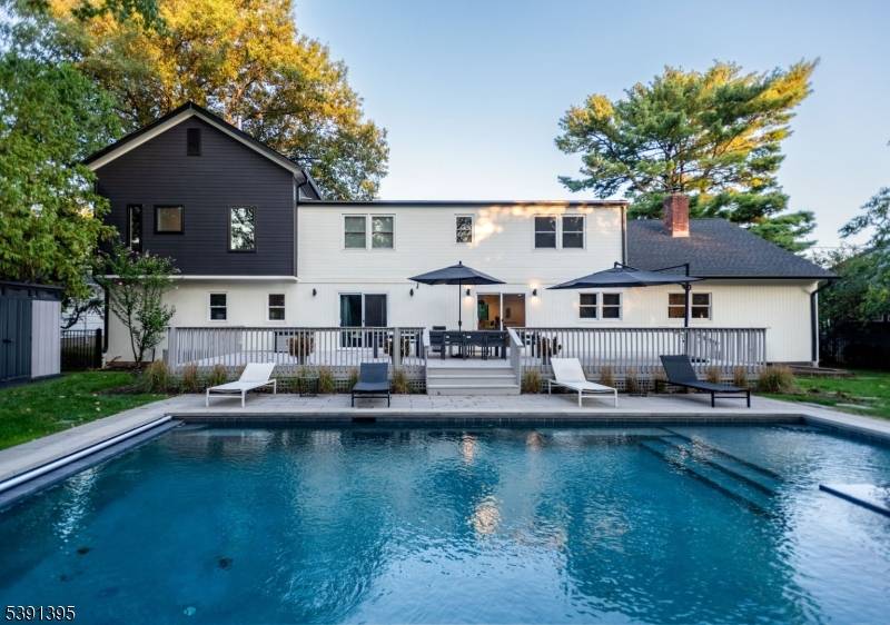 ULTRA Chic and SPACIOUS Mid Century Modern Custom home in Prestigious NEWSTEAD with a Perfect EASTERN exposure to the New York City skyline.