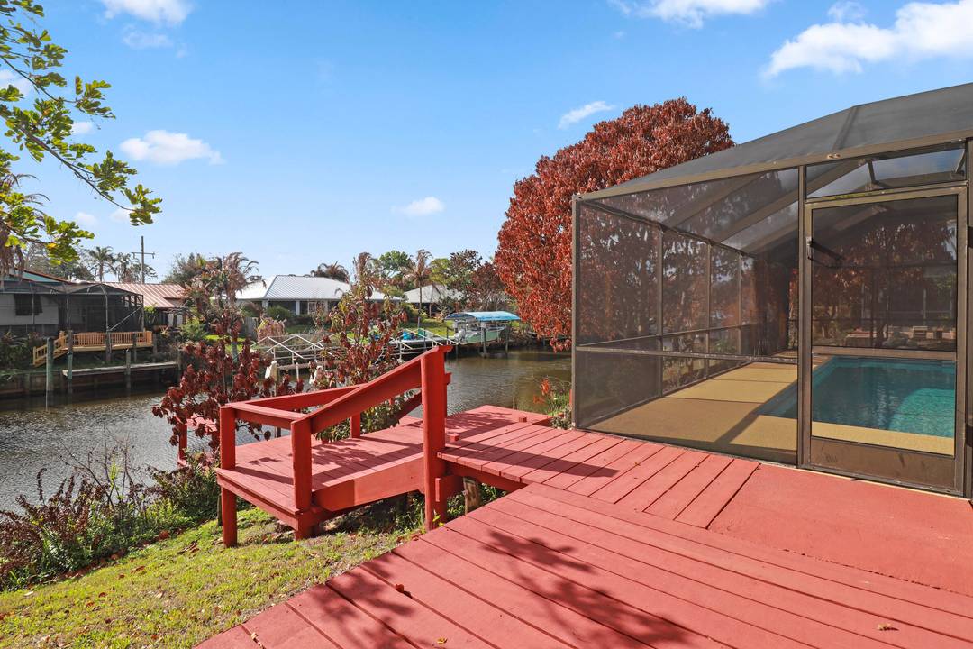 Calling all boaters, this beautiful pool home features a screened in pool, ample patio space for entertaining, and access to the Treasure Coast's coveted waterways !