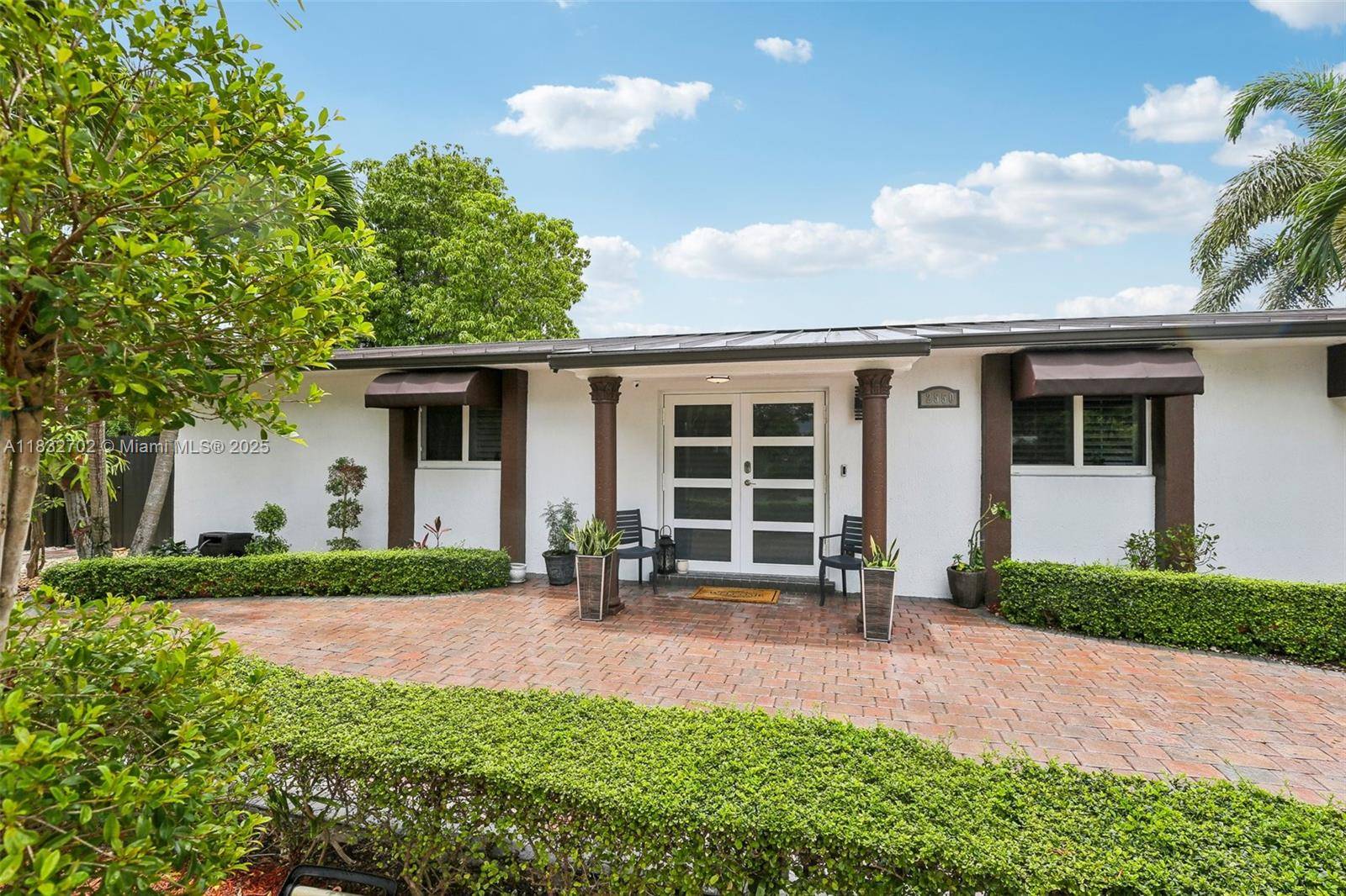 This charming 3 2 corner home features an open concept living area filled with natural light, an updated kitchen with quartz countertops, and a spacious master suite.