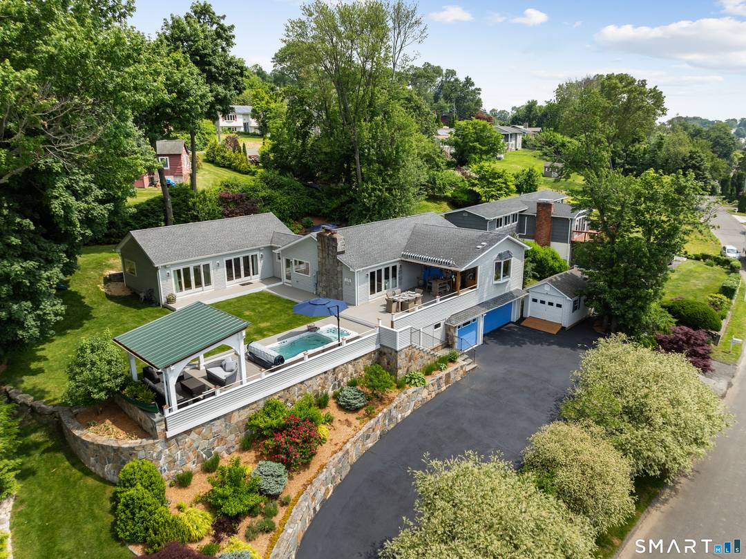 Welcome to this gorgeous, fully renovated Ranch style retreat with stunning views of Candlewood Lake.
