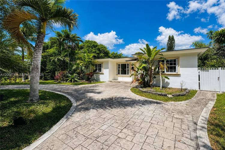 Move in ready and beautifully updated, this 4 bedroom, 2 bath home is nestled in a quiet, sought after area of Miami Springs.