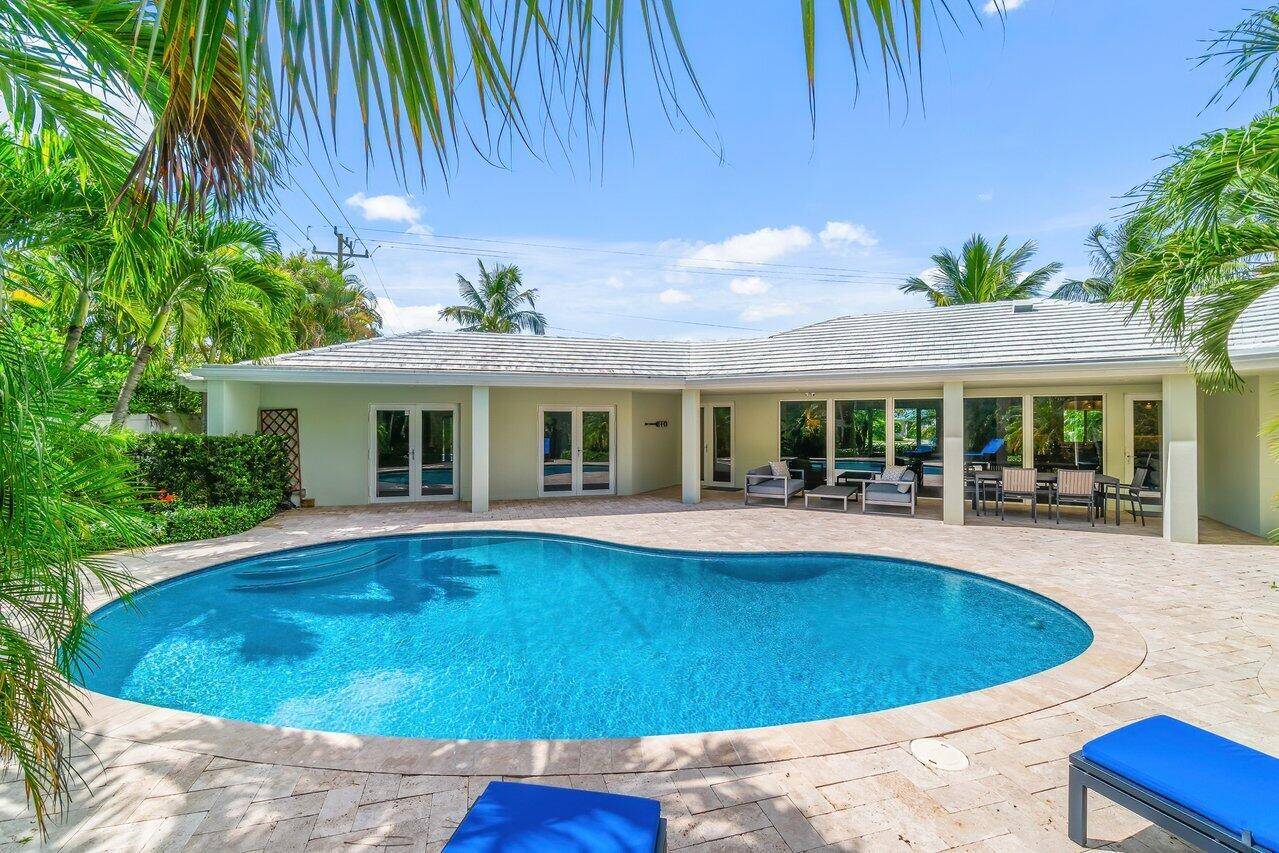 This open and inviting 3 bedroom, 3 bathroom, beautifully appointed pool home sits on a large corner lot in the heart of Delray's prestigious Lake Ida neighborhood.