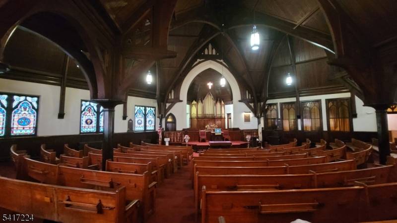 RELIGIOUS FACILITY WITH AN ADJACENT DETACHED HOUSE AND PARKING LOTS ON ONE 0.
