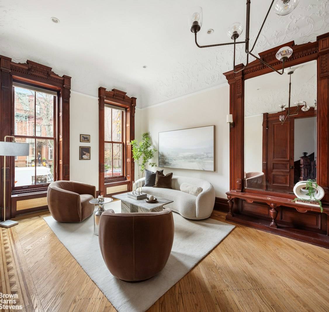 Step into this meticulously restored brownstone at 201 Hancock Street and experience timeless elegance blended with modern luxury.