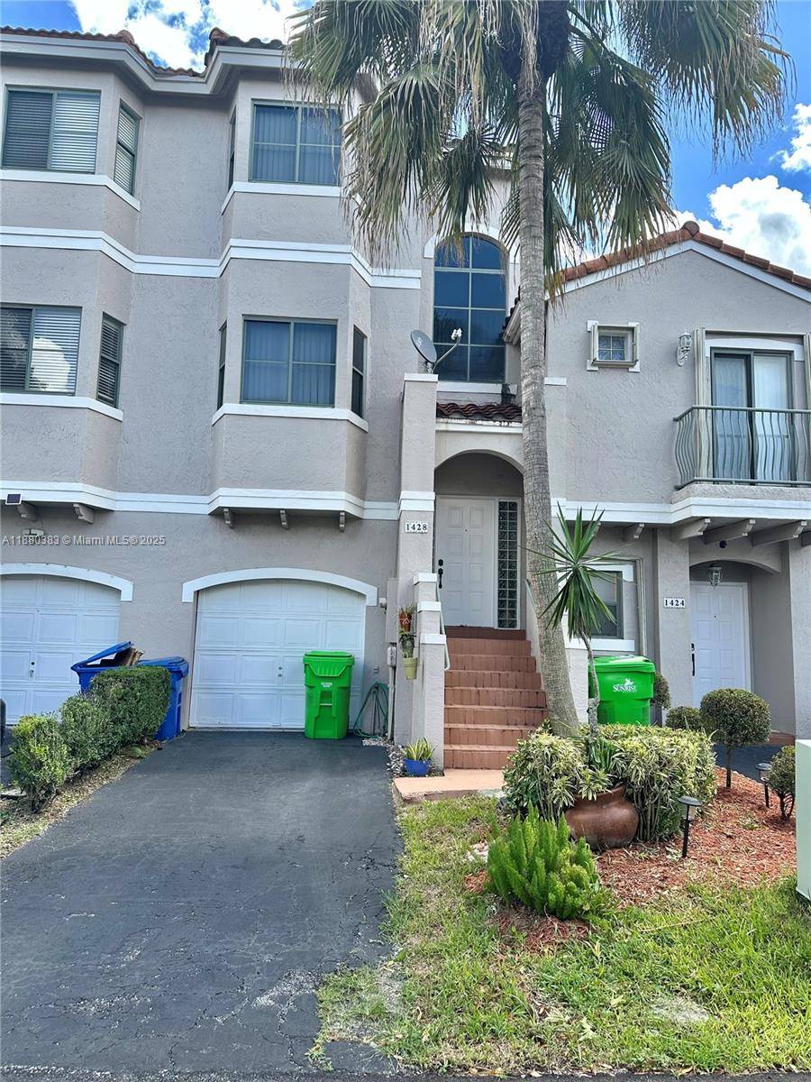 Three story townhouse with beautiful lake view located in the community of Allegro Sawgrass Mills.