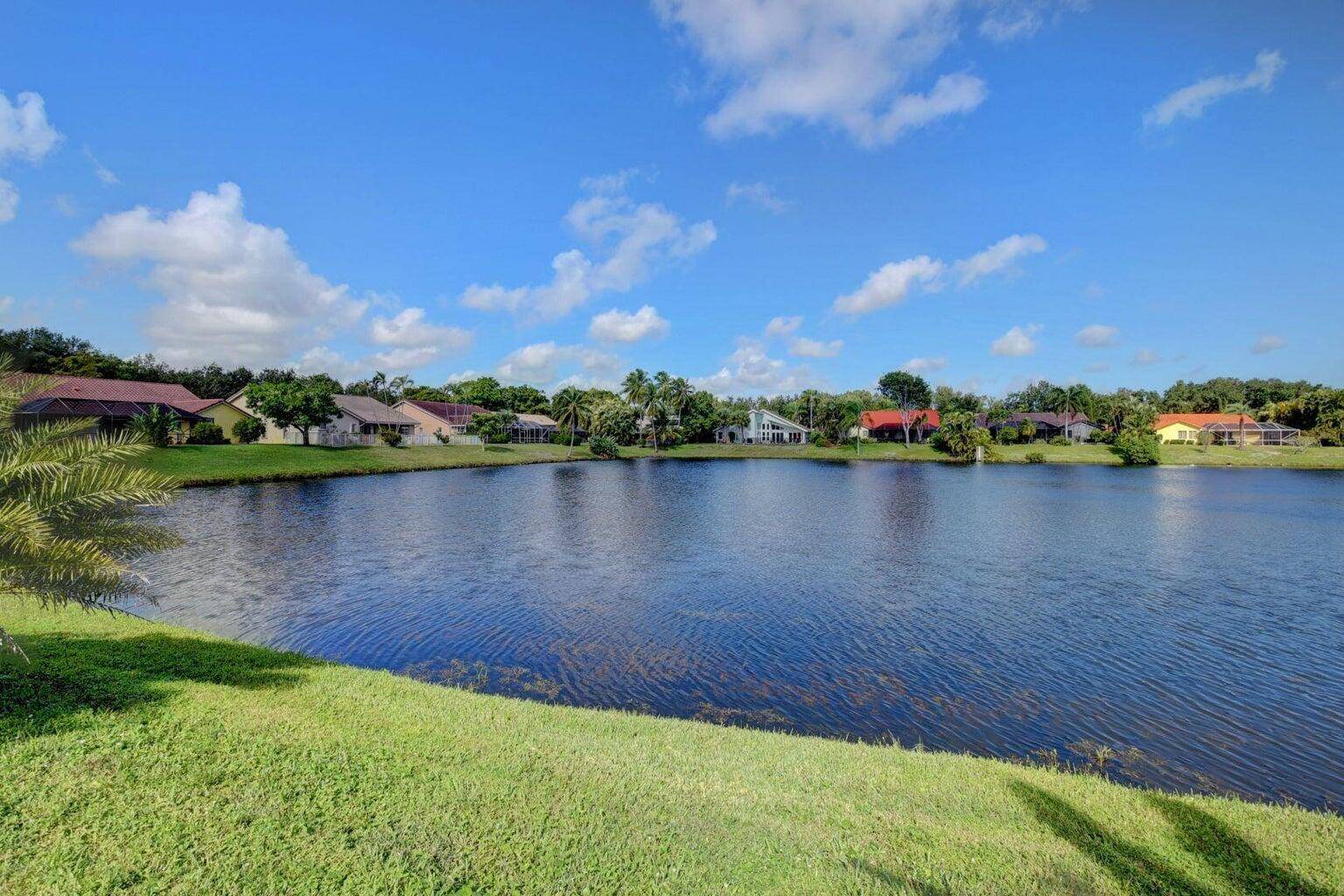 Step through the front door and be instantly captivated by a breathtaking waterfront view that sets the tone for this tranquil, beautifully designed home.