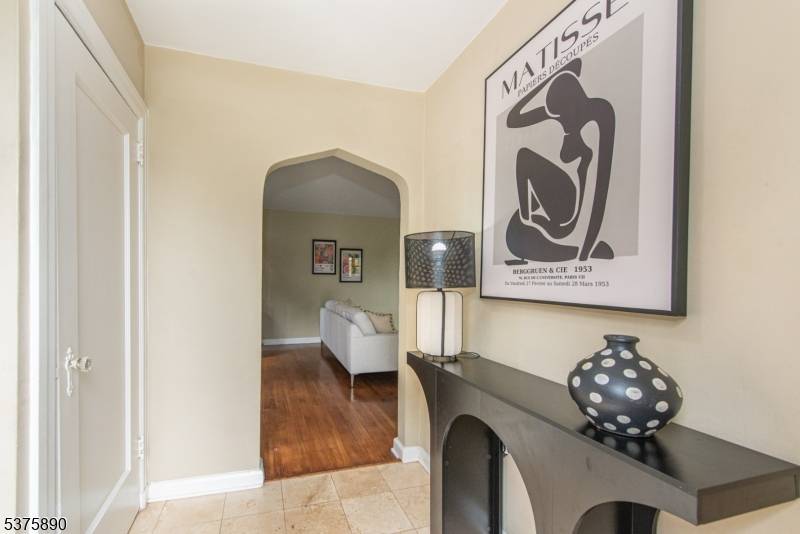 Picture perfect Tudor in sought after Upper Gregory section with partial NYC views.