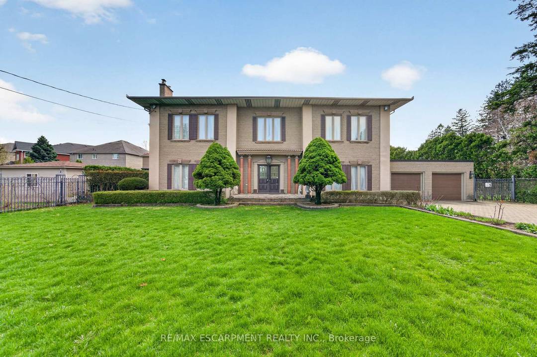 Spectacular gated estate on a rare 1 acre lot in a desirable, rapidly developing area.