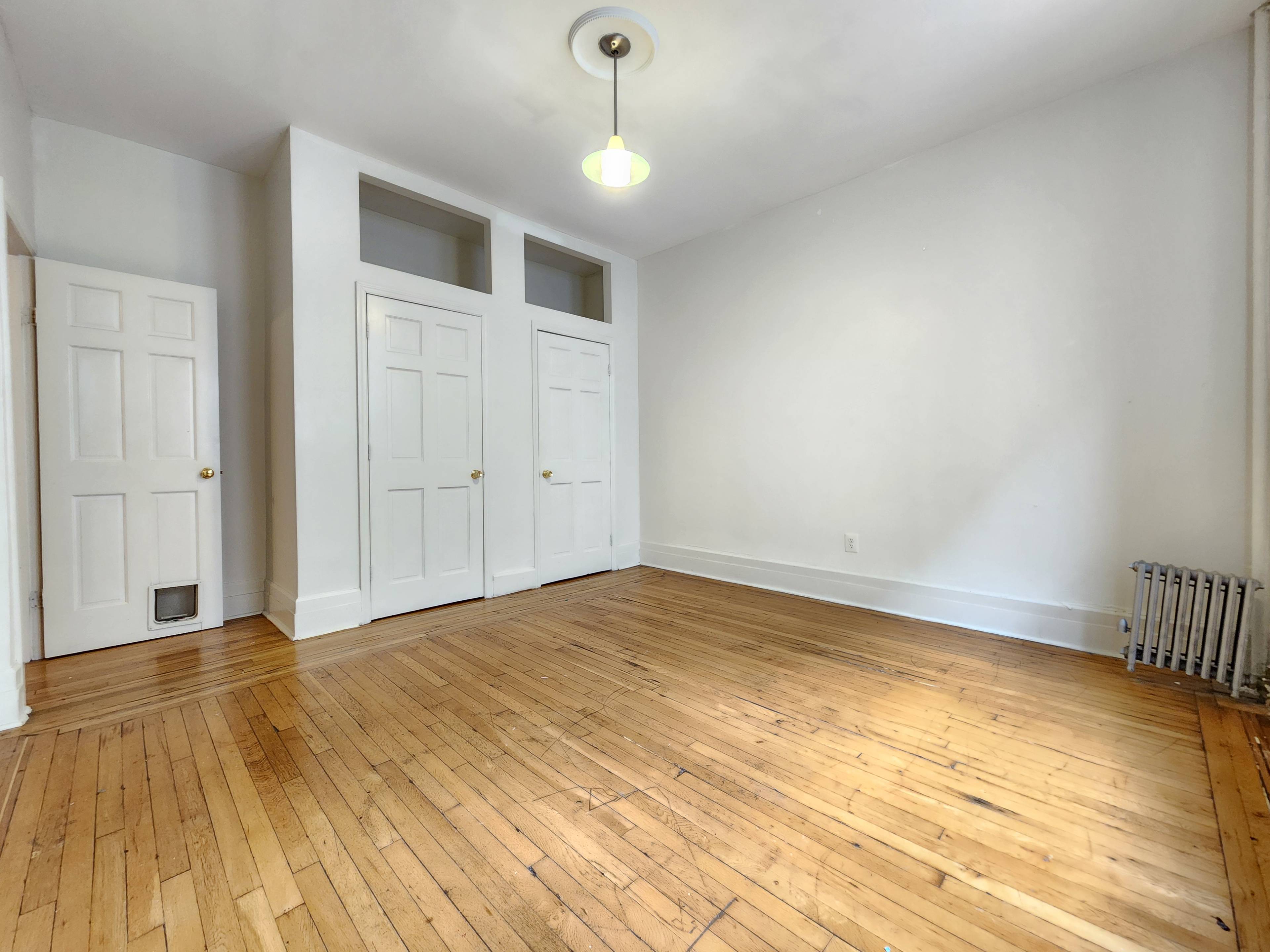 Incredibly Spacious Hamilton Heights 4BR 2BA Featuring Hardwood Floors, Exposed Bricks, SS Appliances, and Dishwasher.