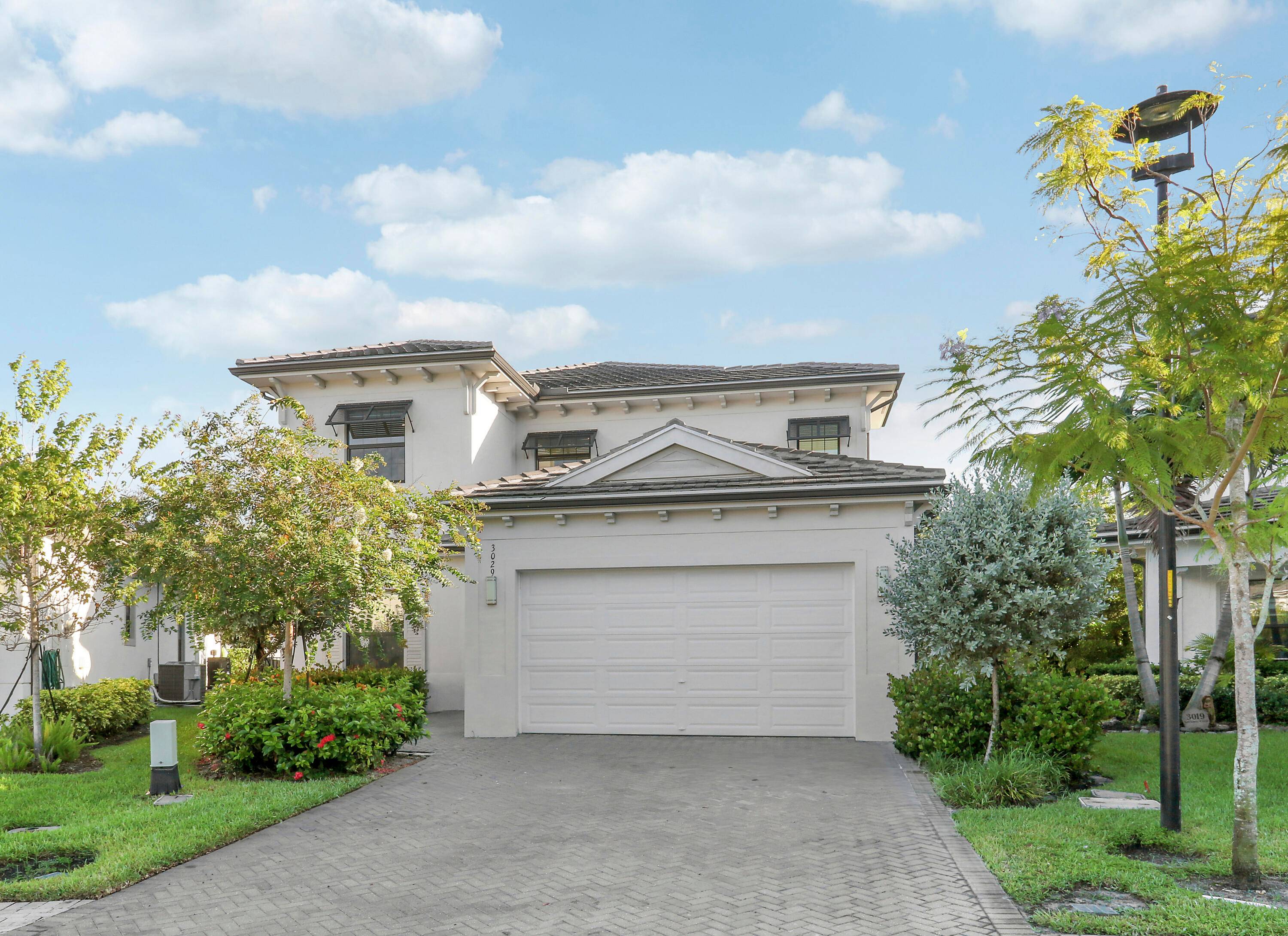 Welcome to the gated community of Banyan Cay, where luxury living meets modern design.